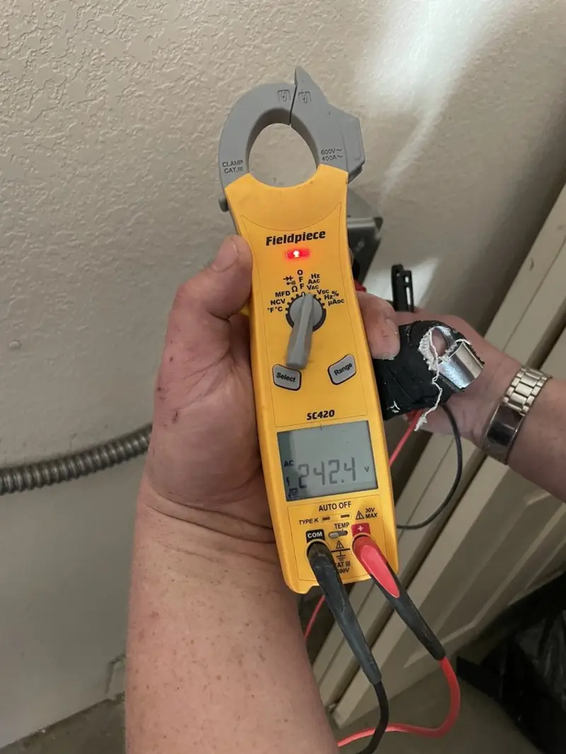 Voltage testing with clamp meter during Ceiling Fan Installation in Maltby